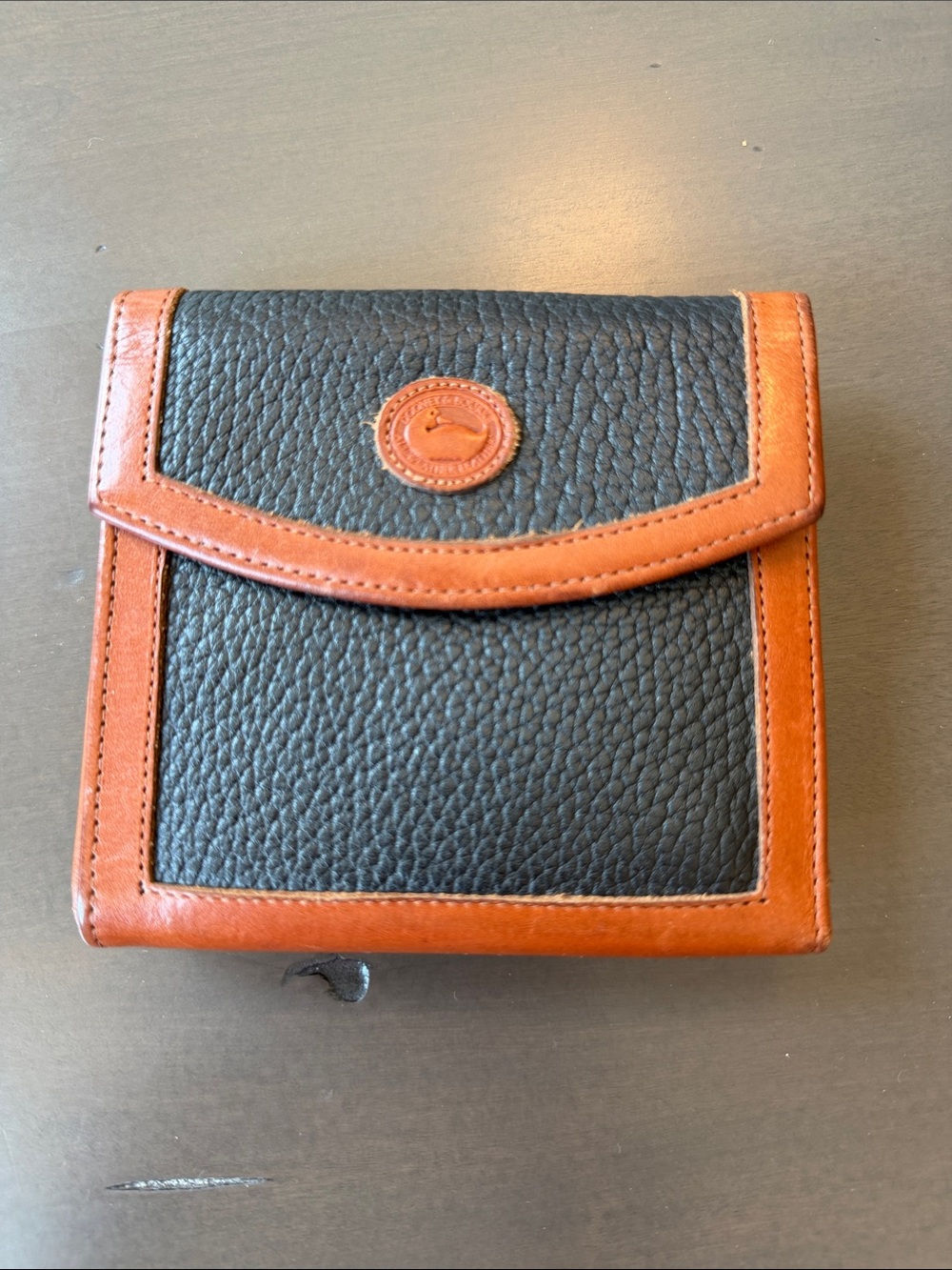 Dooney & Bourke Classic Black Pebbled All Weather Leather Wallet with Tan Trim